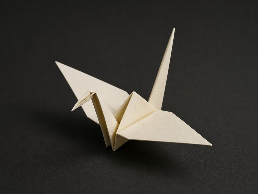 Ivory origami crane representing a clear and carefully formed idea.